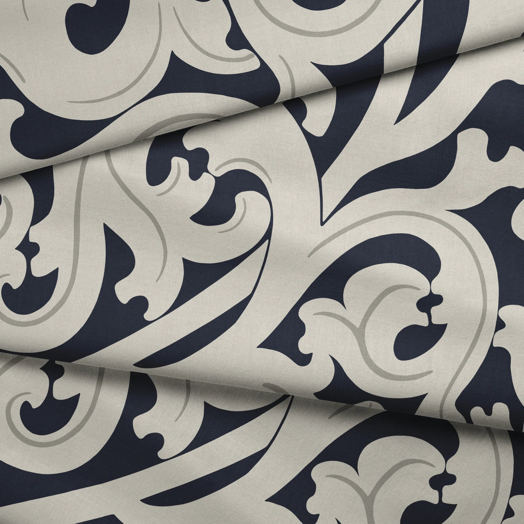 Large beige acanthus scroll motif on a navy ground: draped fabric fold preview.