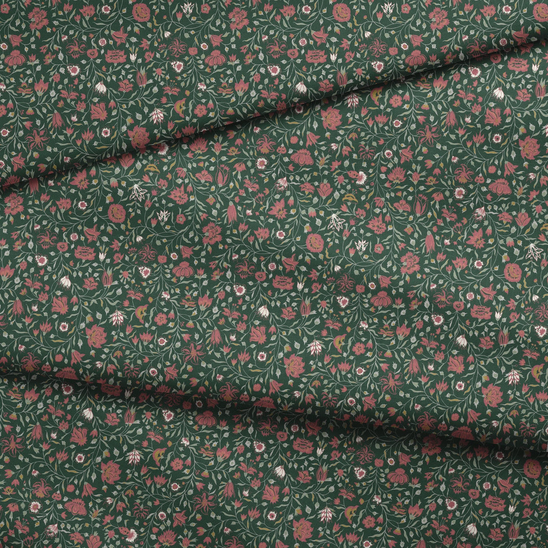 Red 18th century Indian chintz vine on a dark green ground: draped fabric fold preview.