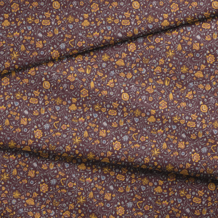 Yellow 18th century Indian chintz vine on a dark purple ground: draped fabric fold preview.