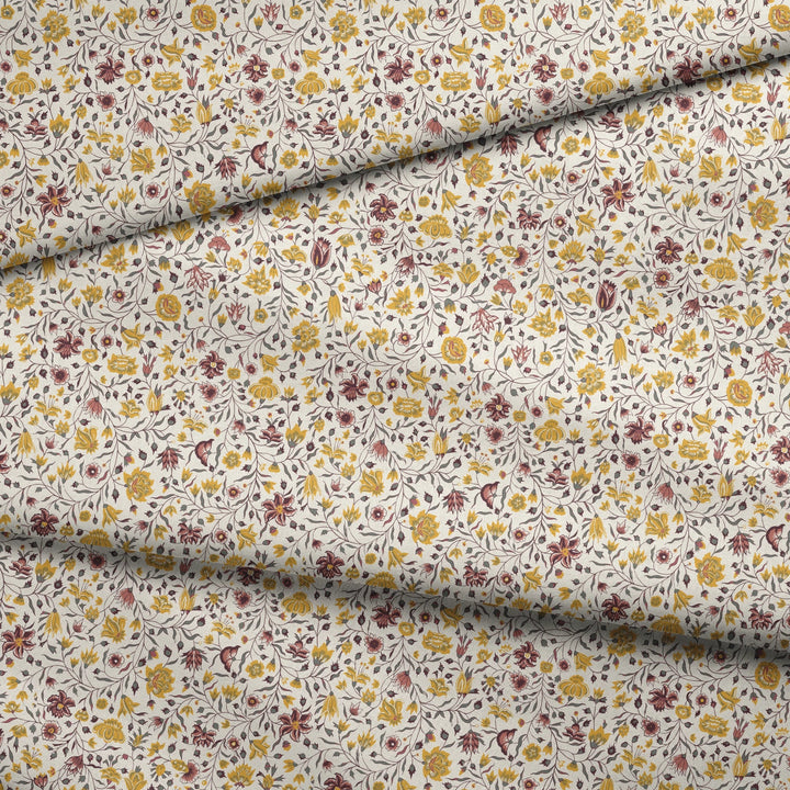 Yellow 18th century Indian chintz vine on a white ground: draped fabric fold preview.
