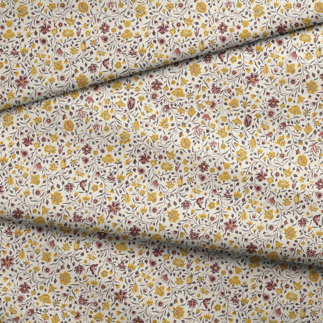 Yellow 18th century Indian chintz vine on a white ground: draped fabric fold preview.