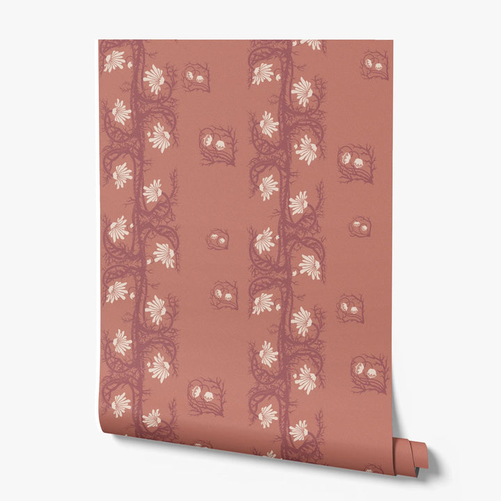 Marguerite in terracotta and pomegranate: spined, entwined stems forming vertical channels around massed daisy heads, translated from a c. 1904 Dutch linen damask finger towel by Cornelis van der Sluys. printed wallpaper roll