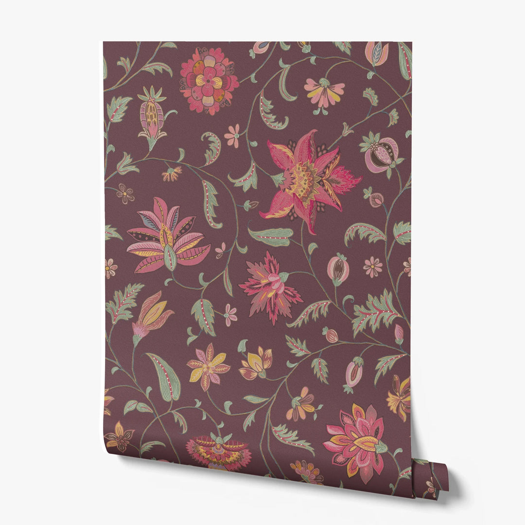 Red and gold florals on a dark purple ground printed wallpaper roll