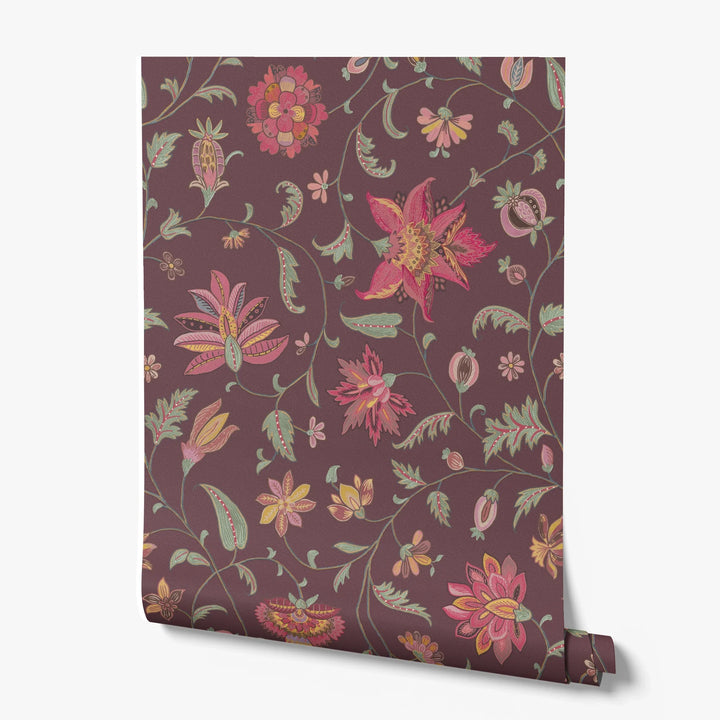 Red and gold florals on a dark purple ground printed wallpaper roll