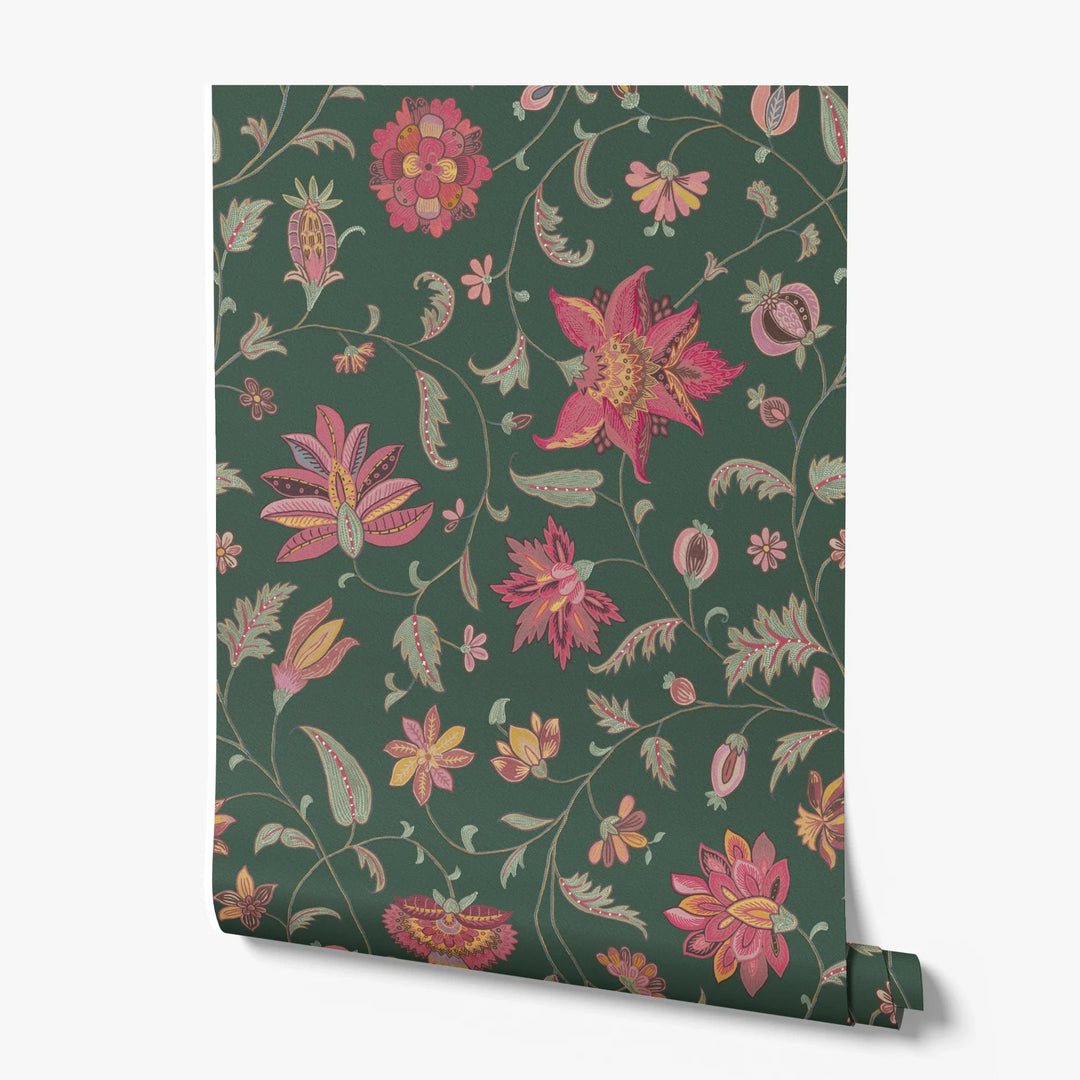 Red and gold florals on a dark green ground printed wallpaper roll