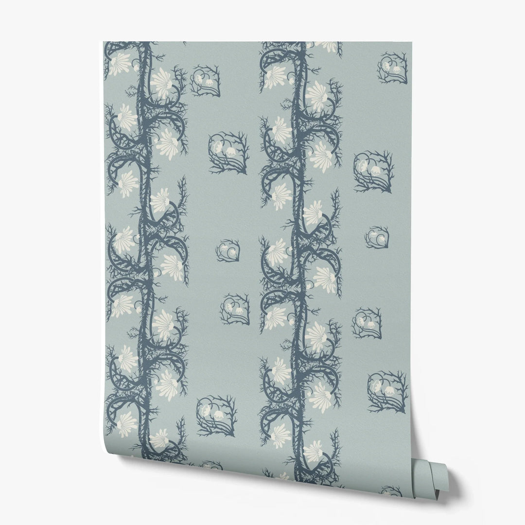 Marguerite in mist and slate: spined, entwined stems forming vertical channels around massed daisy heads, translated from a c. 1904 Dutch linen damask finger towel by Cornelis van der Sluys. printed wallpaper roll