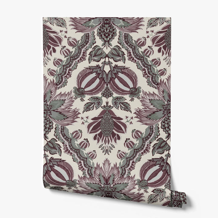 Flowering Pomegranate in linen and blackcurrant: an ogee lattice of lace borders framing a blossom held between two swelling pomegranates, translated from an 18th-century French block-printed quilt. printed wallpaper roll