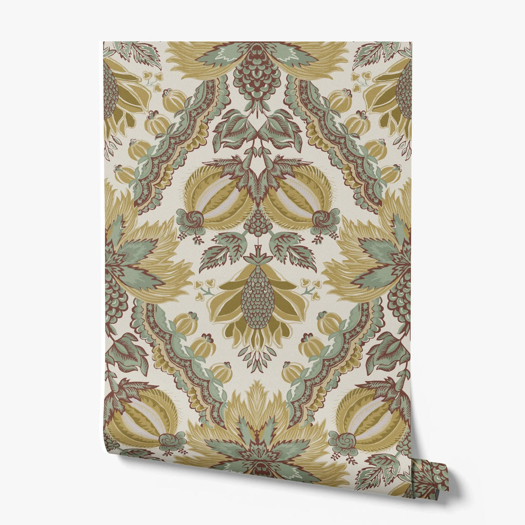 Flowering Pomegranate in linen and honey: an ogee lattice of lace borders framing a blossom held between two swelling pomegranates, translated from an 18th-century French block-printed quilt. printed wallpaper roll